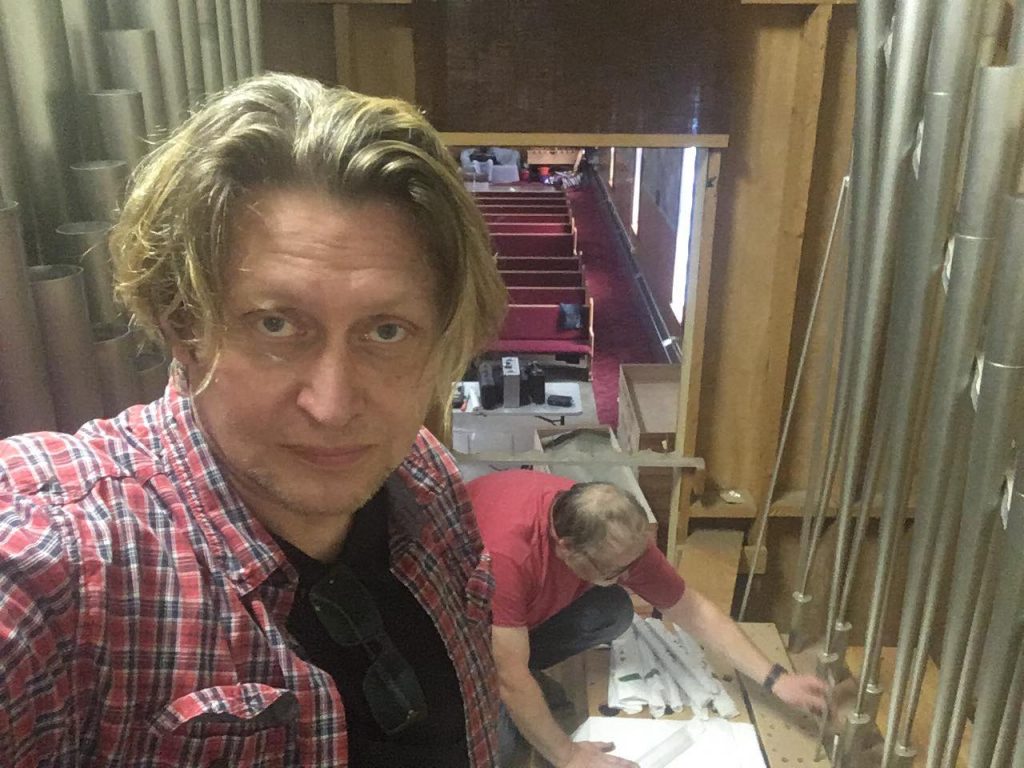 Xaver Varnus looks on as his pipe organ is taken apart before transport