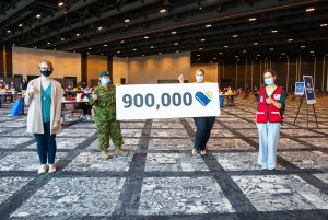 Staff at Haifax Convention Centre vaccination site celebrate 900,000 vaccines administered across Nova Scotia