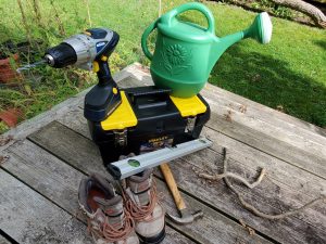 Hand tools and a toolbox sitting on a deck