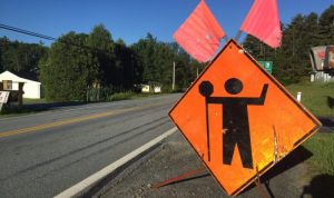 a roadside construction sign